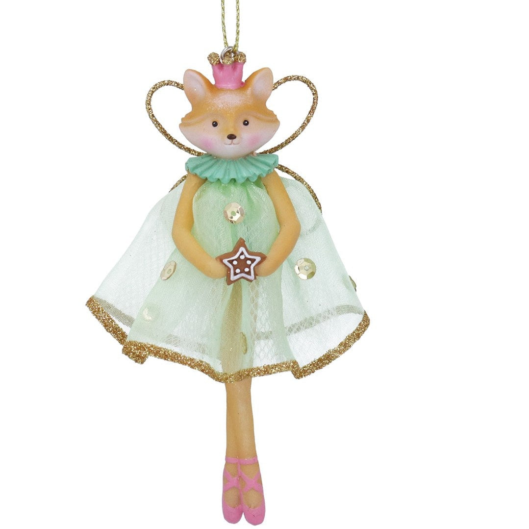 Decorative fox figurine in a green dress with a star, on a white background