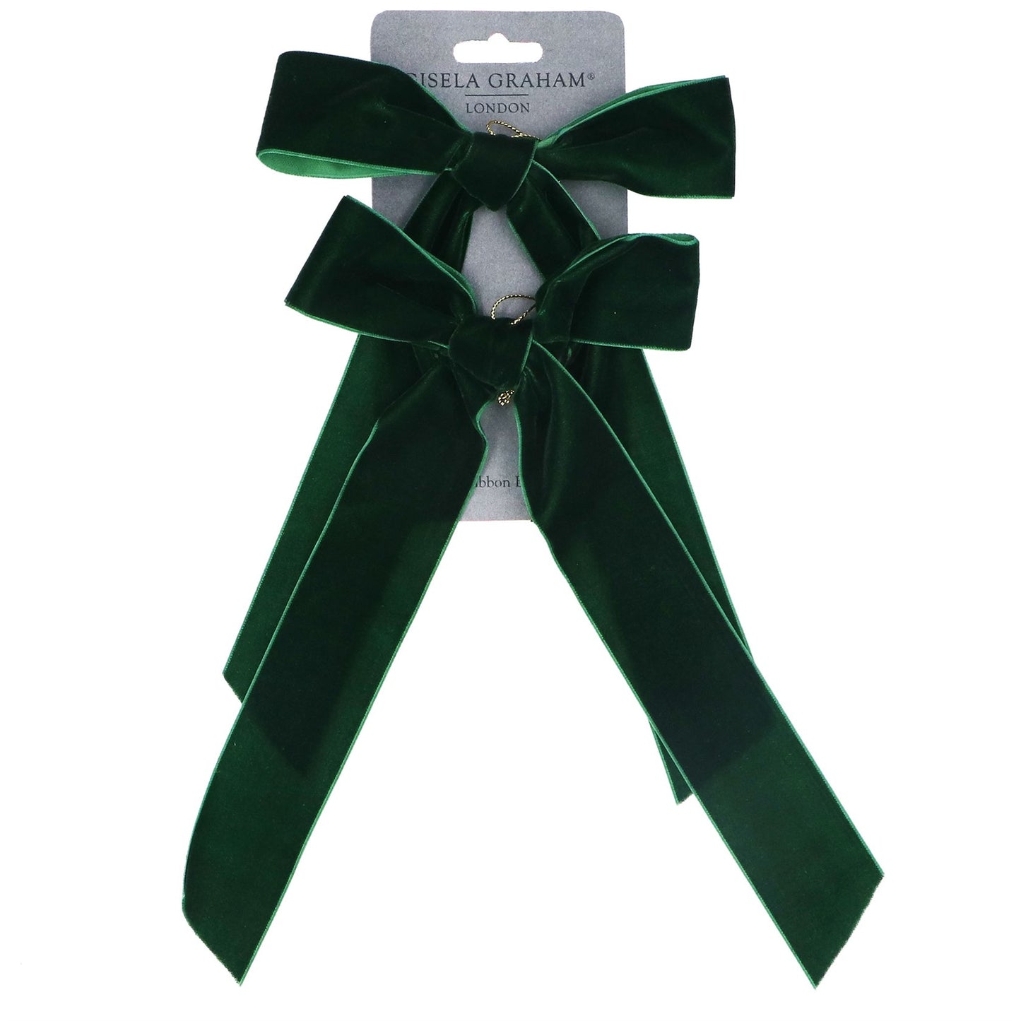 A dark green velvet bow Christmas decorations with long ribbon tails, attached to a light grey cardboard hanger card. The brand name 'Gisela Graham London' is printed on the card.