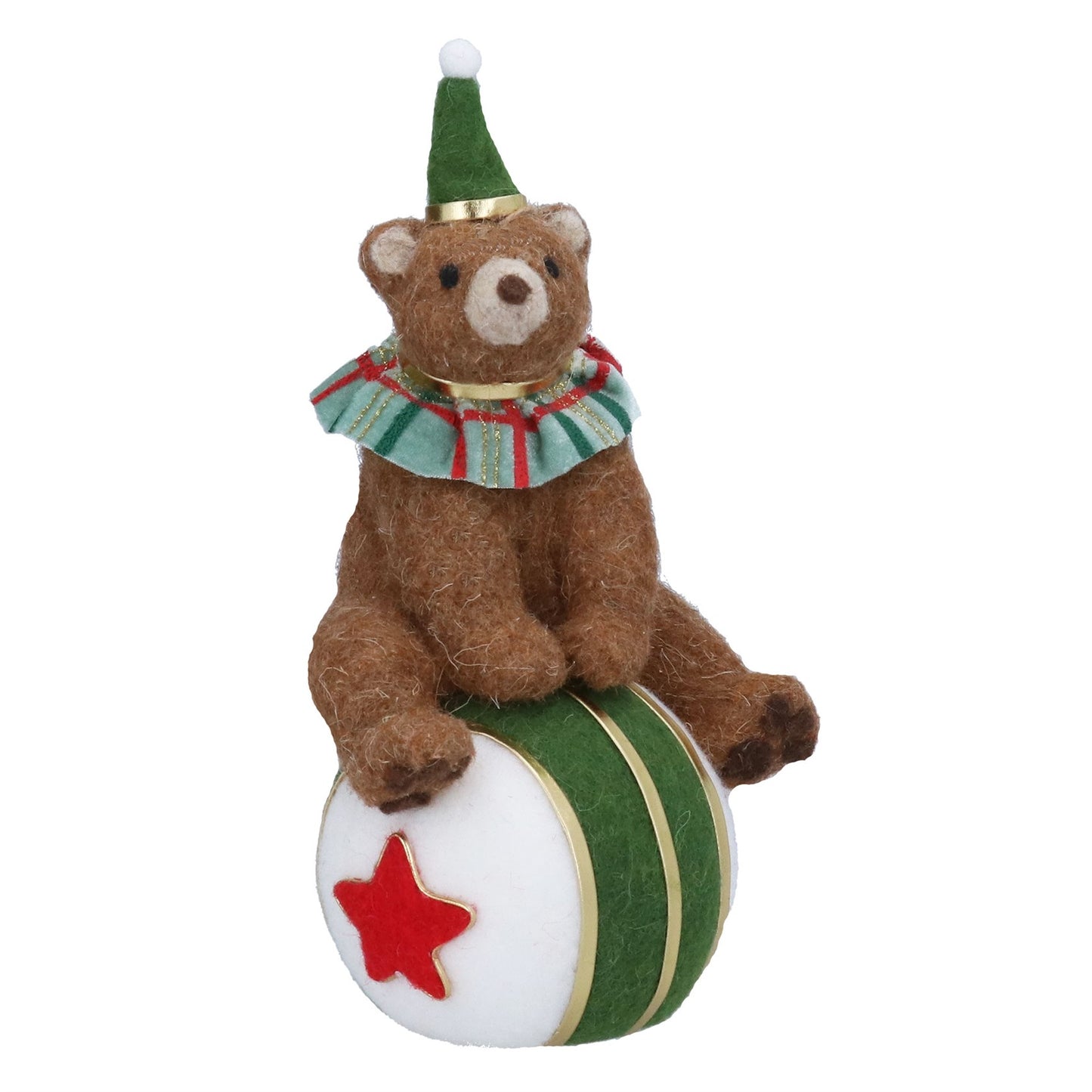 A brown teddy bear figurine wearing a green elf hat with a white pom-pom and a green and red striped ruffled collar, sitting on top of a white ball with green stripes and a red star, isolated on a white background.