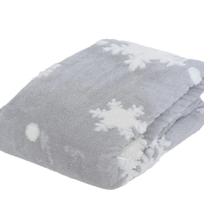 A grey blanket with a white snowflake pattern, folded or draped casually.