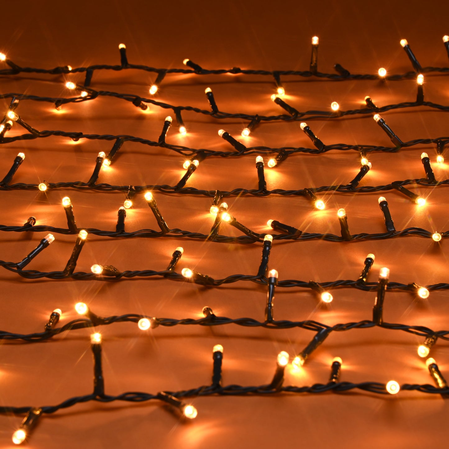 String lights on a mesh background with warm glow