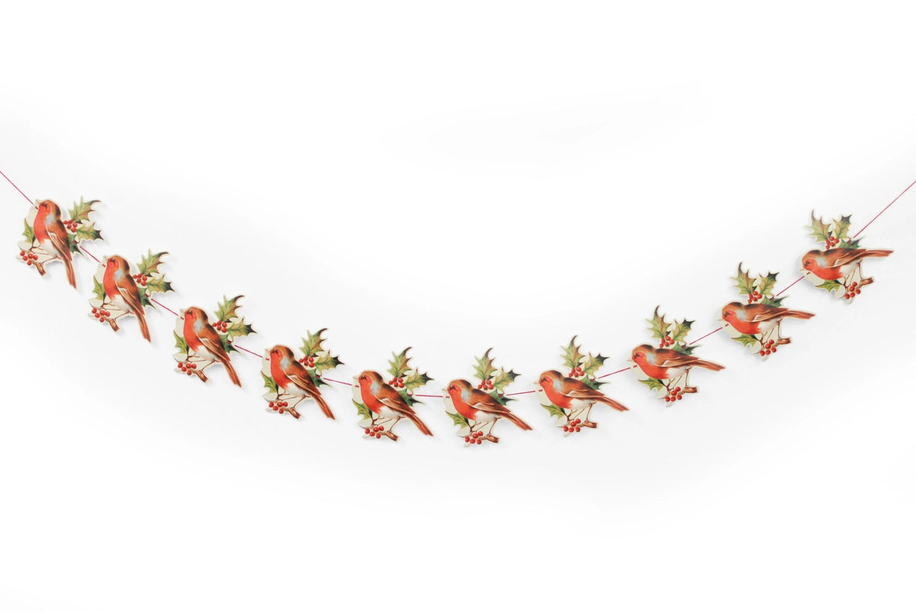 A die-cut and embossed paper garland featuring repeated motifs of a robin and holly, with a length of 3 meters and a height of 17.5 cm.
