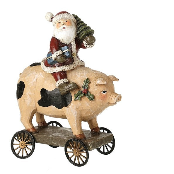 Decorative figurines of Santa riding a pig on a white background