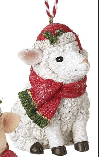 hanging festive sheep, wearing a Santa hat and scarf on a white background