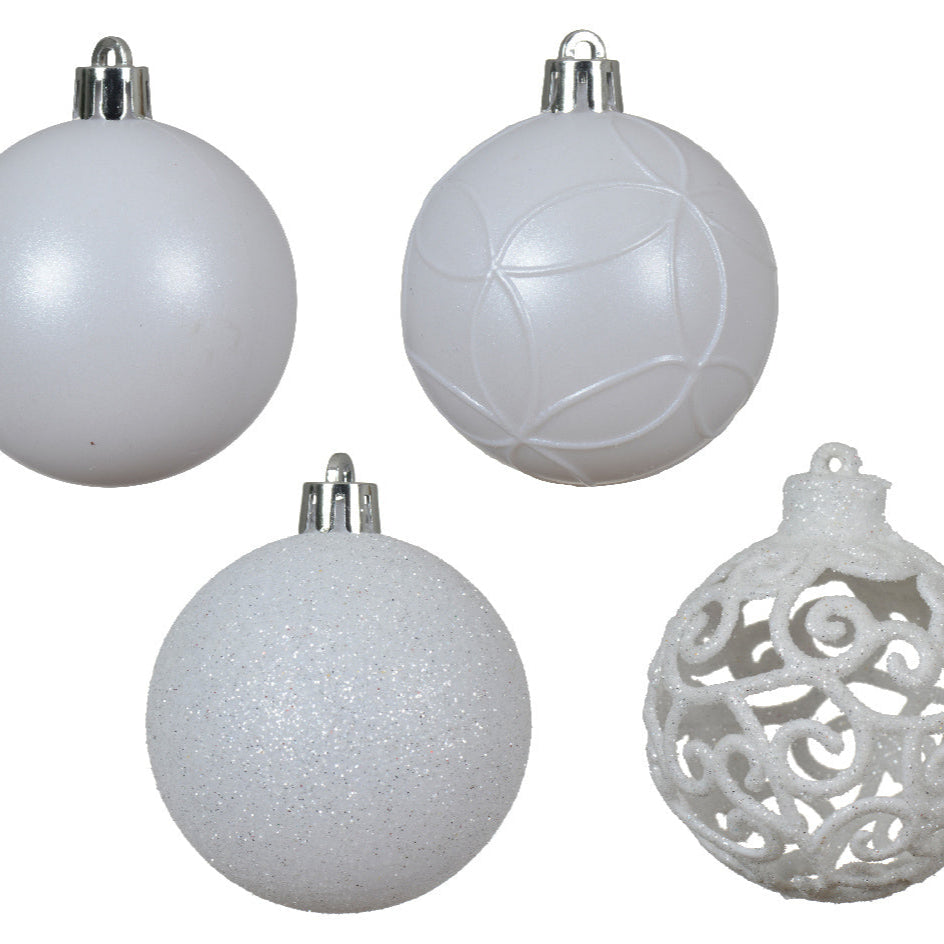 Four white Christmas ornaments with different textures on a white background