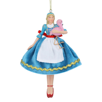 Decorative ornament of a character in a blue dress holding a pink flamingo on a white background