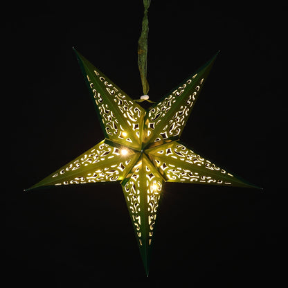 A five-pointed star-shaped hanging ornament with intricate cutout patterns, glowing with warm yellow light against a solid black background.
