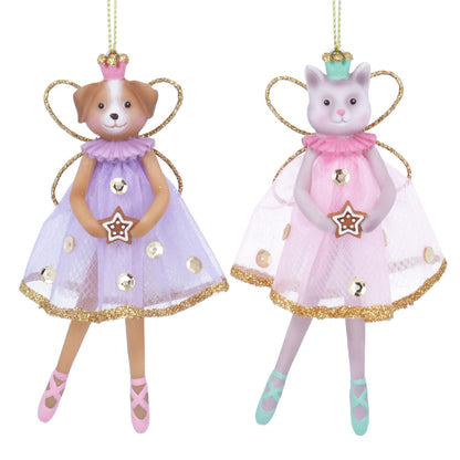 Two angelic figurines, one dog and one cat, wearing purple and pink dresses with gold accents on a white background.