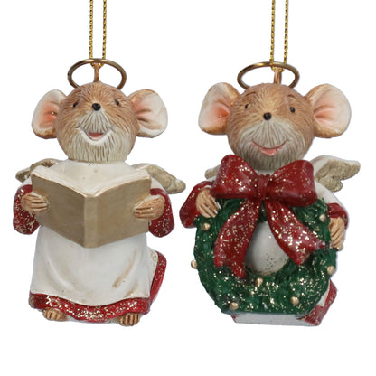 Two Christmas mouse ornaments on a white background. One mouse is dressed as an angel in a white robe with red glitter trim, holding a beige book.