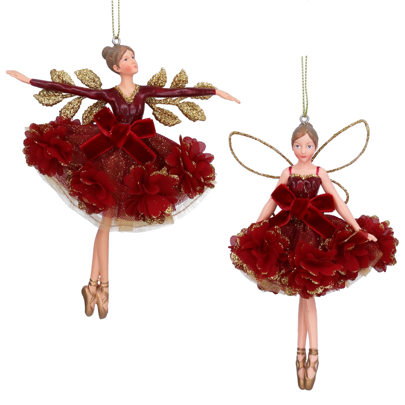 Two decorative fairy ornaments with red and gold dresses on a white background