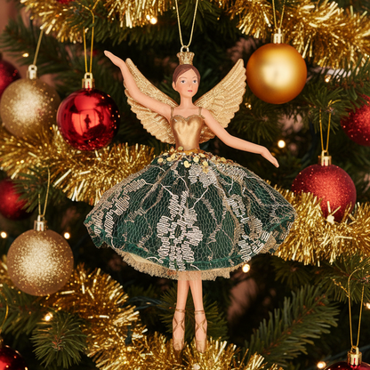 A decorative ballerina figurine with gold wings, a gold crown, and a green and white patterned tutu skirt, posed against a Christmas tree background.