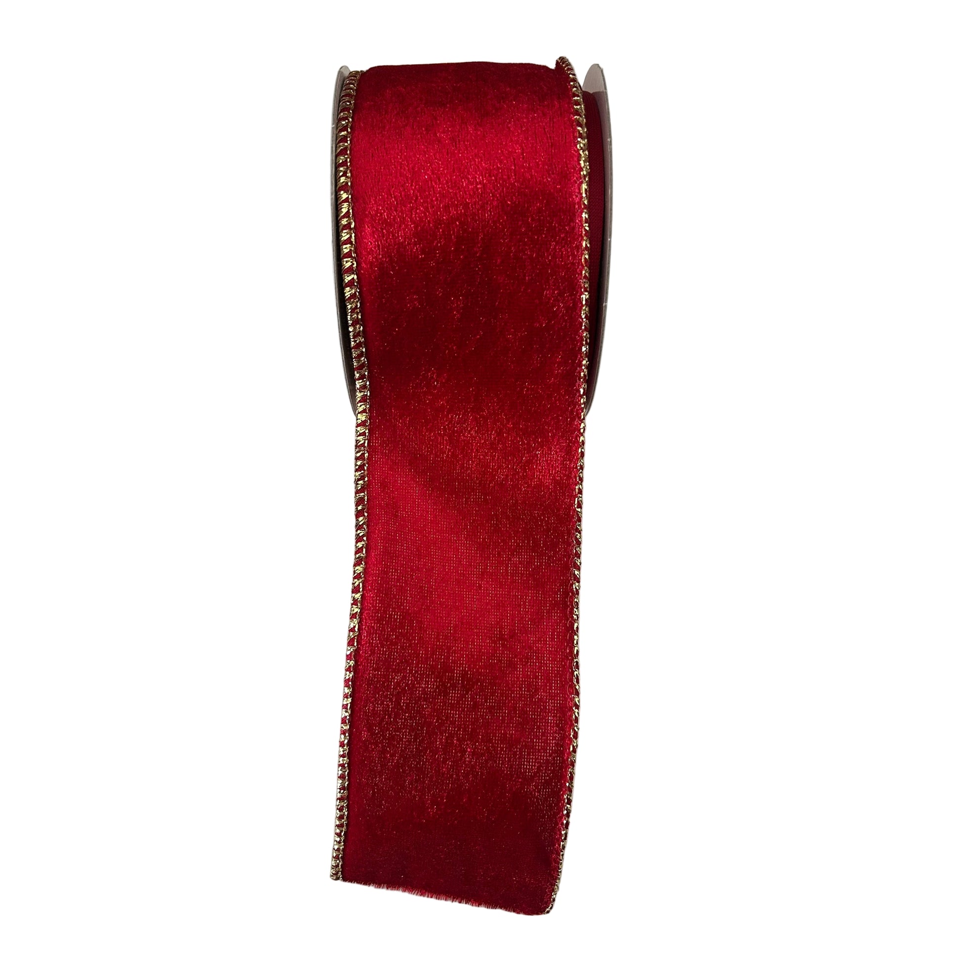 Red velvet ribbon with gold edge on a  white surface