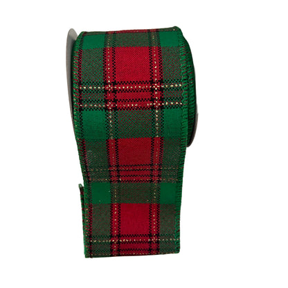 Roll of green and red plaid ribbon on a white background