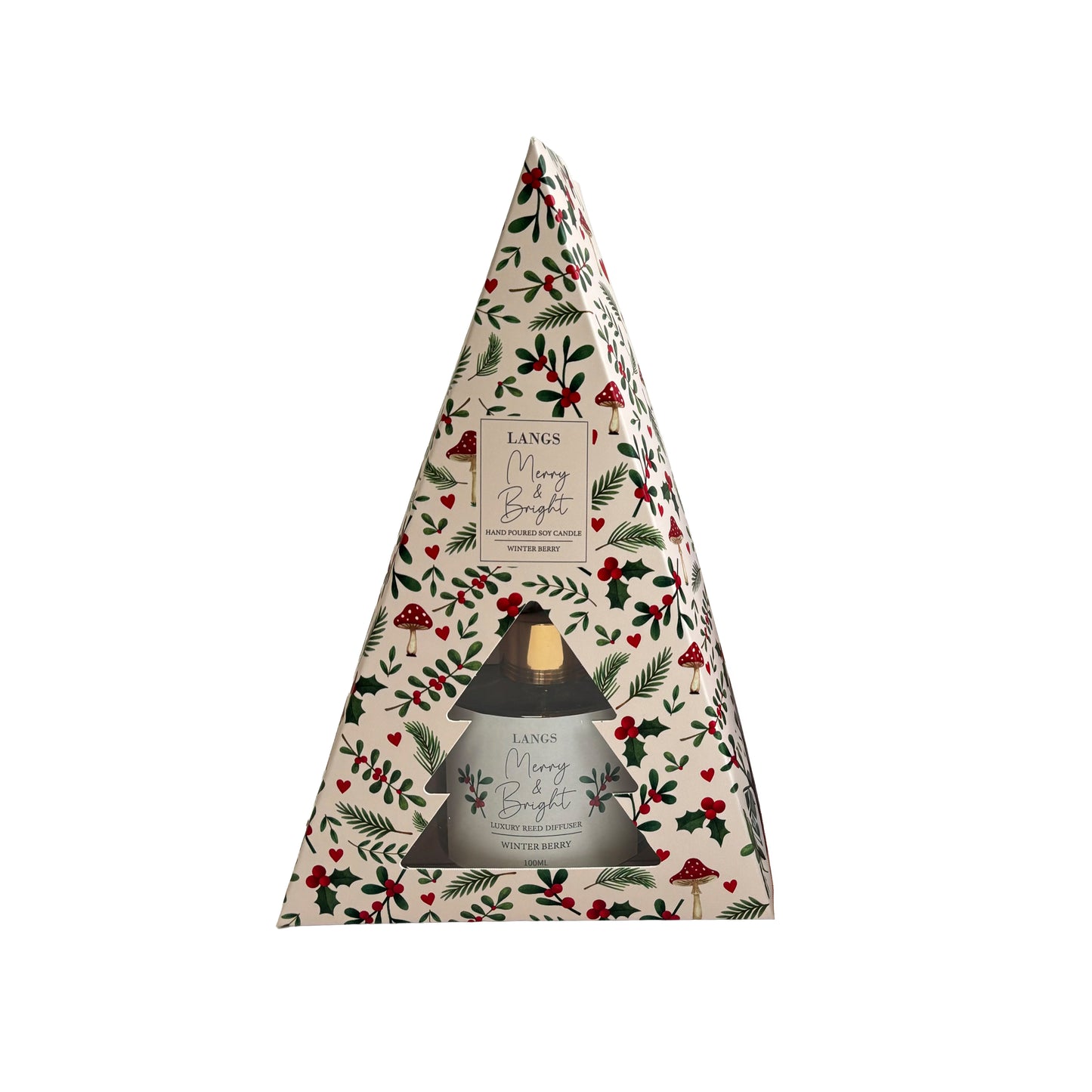 A triangular candle gift box from Langs, featuring a festive Christmas holly and berry pattern on a cream background, with a clear window showing product