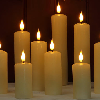 A group of cream-colored pillar candles with lit flame tops, arranged on a light surface against a dark brown background.