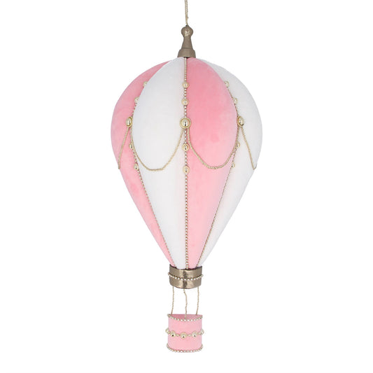 A pink and white hot air balloon-shaped wall plaque decoration with a chain of lights at the top and a foam handle at the bottom.