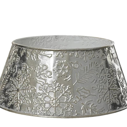 Decorative metal  Christmas tree skirt with snowflake pattern on a white background
