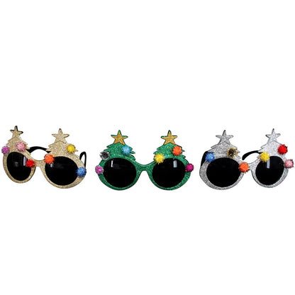 A set of three novelty Christmas tree design glasses with a choice of gold, green, or silver colors and glitter finish. Each glass is adorned with a Christmas tree and colored pom-poms.