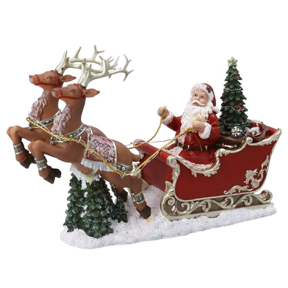 Decorative figure of Santa Claus in a sleigh pulled by reindeer with Christmas trees on a white background