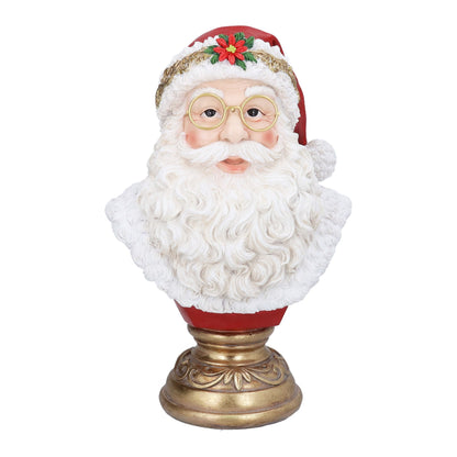 A Santa Claus bust figurine with a long white beard, red hat with a green holly accent, round gold-rimmed glasses, and an ornate gold pedestal base, shown on a plain white background.