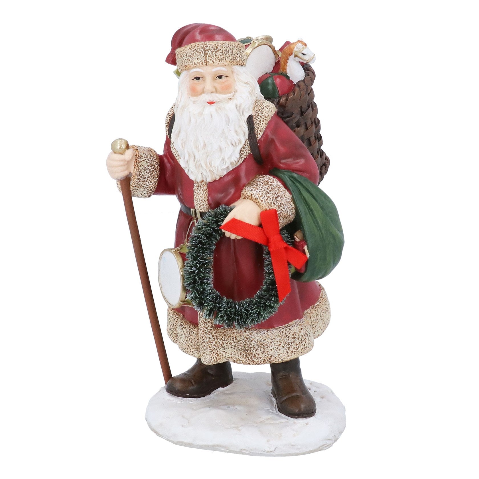 Decorative figurine of a Santa Claus holding a wreath and walking stick on a white background