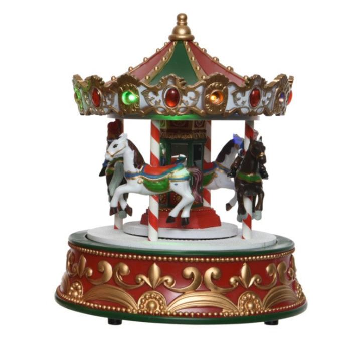 A colorful Christmas-themed musical carousel with figurines of horses and riders, decorated with multicolored LED lights and festive decorations.
