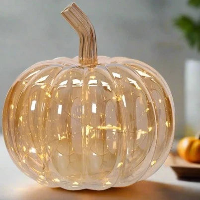 Decorative pumpkin with LED lights on a neutral background