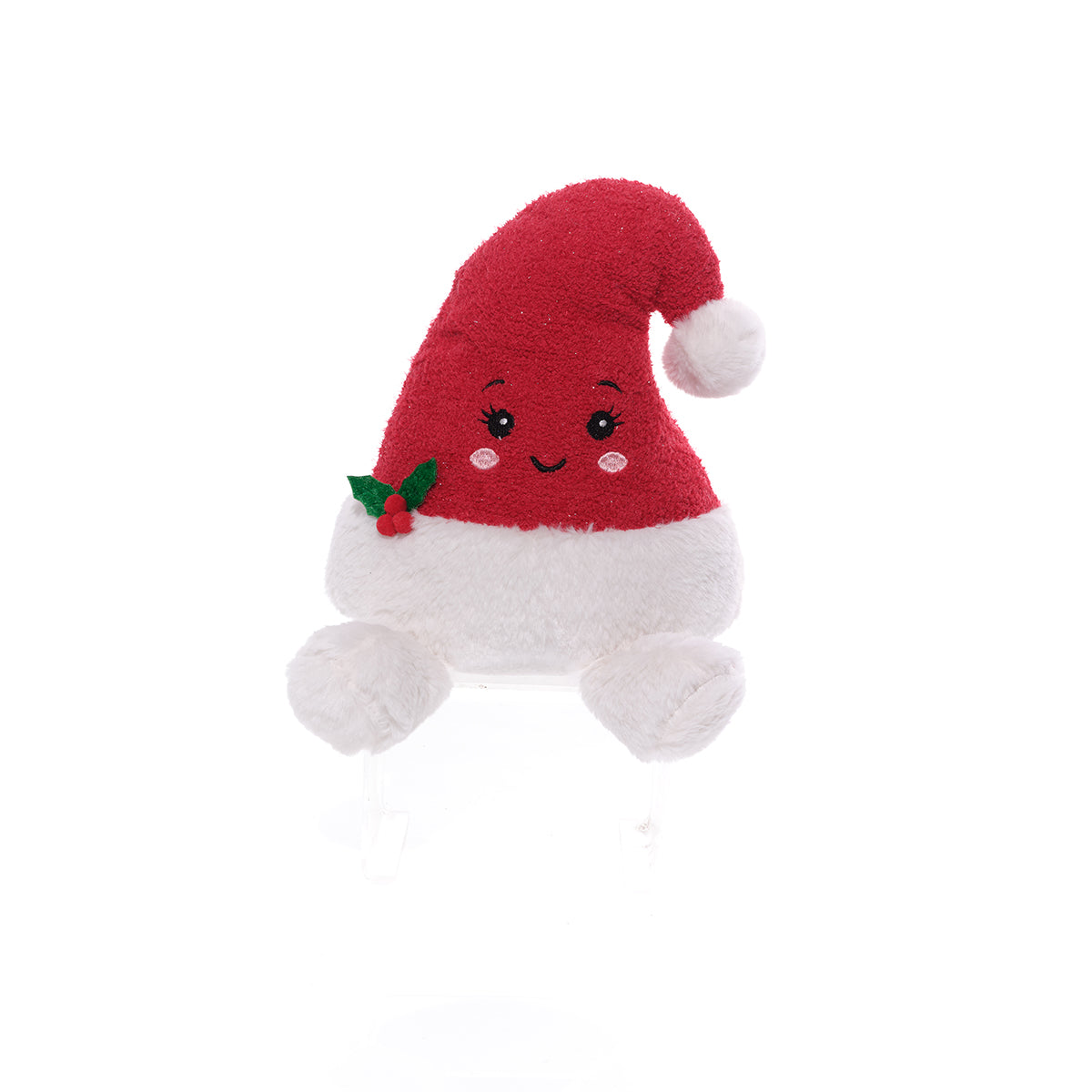 A cute, smiling plush toy shaped like a Santa hat, featuring a red fuzzy hat with a white pom-pom, a white fluffy body, and a small green holly accent on the side.