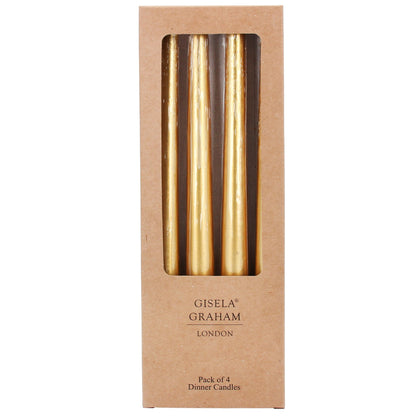 Pack of 4 gold dinner candles in a Gisele Graham London box on a white background