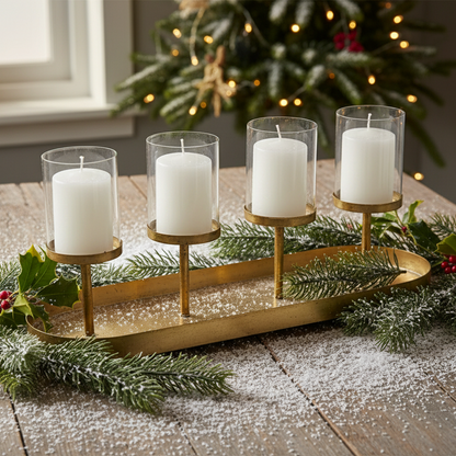 An antique gold vintage style candle holder with four glass hurricane holders and a metal oval tray.
