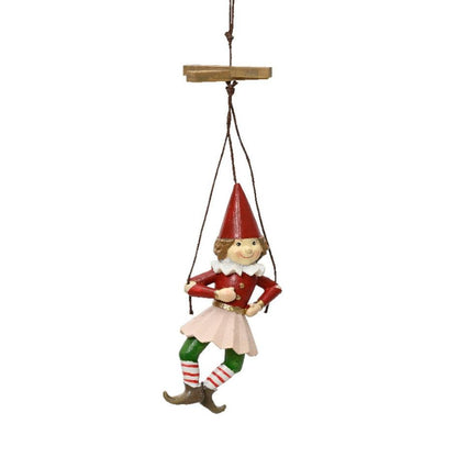 A hanging puppet-style doll dressed in red and green with white stockings and red hat, designed as a Christmas decoration.