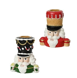 Two decorative nutcrackers with hats on a white background