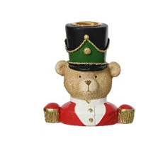 Decorative bear figurine wearing a festive top hat on a white background