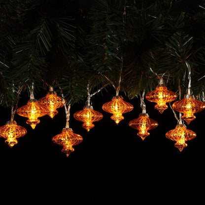 A garland of antique effect glass shades with warm white LED lights, displayed against a dark background.