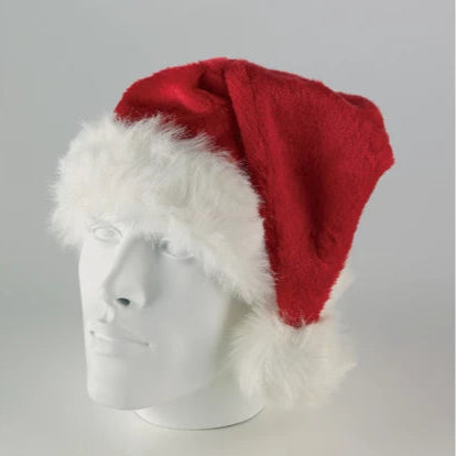 Red Santa hat with white fur on a mannequin head against a gray background