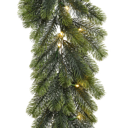 Artificial Christmas garland with lights on a white background