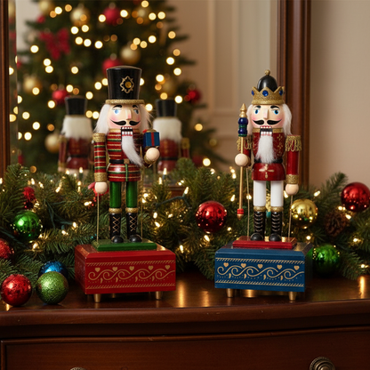 Two nutcrackers on a wooden surface with Christmas decorations and a tree in the background.
