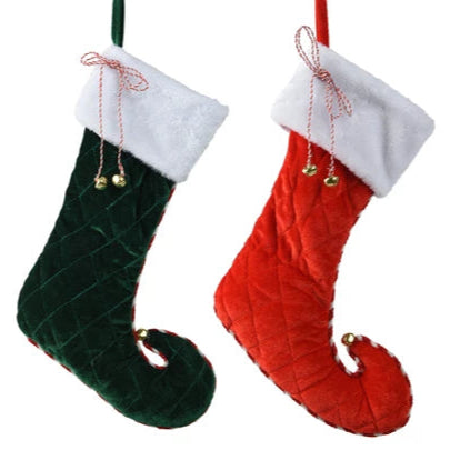 Two Christmas stockings, one green and one red, with white cuffs and gold bells on a white background.