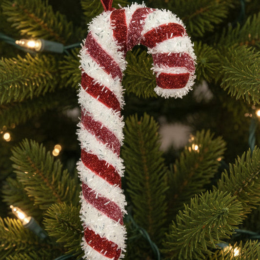 Candy cane ornament with red and white stripes on a white background