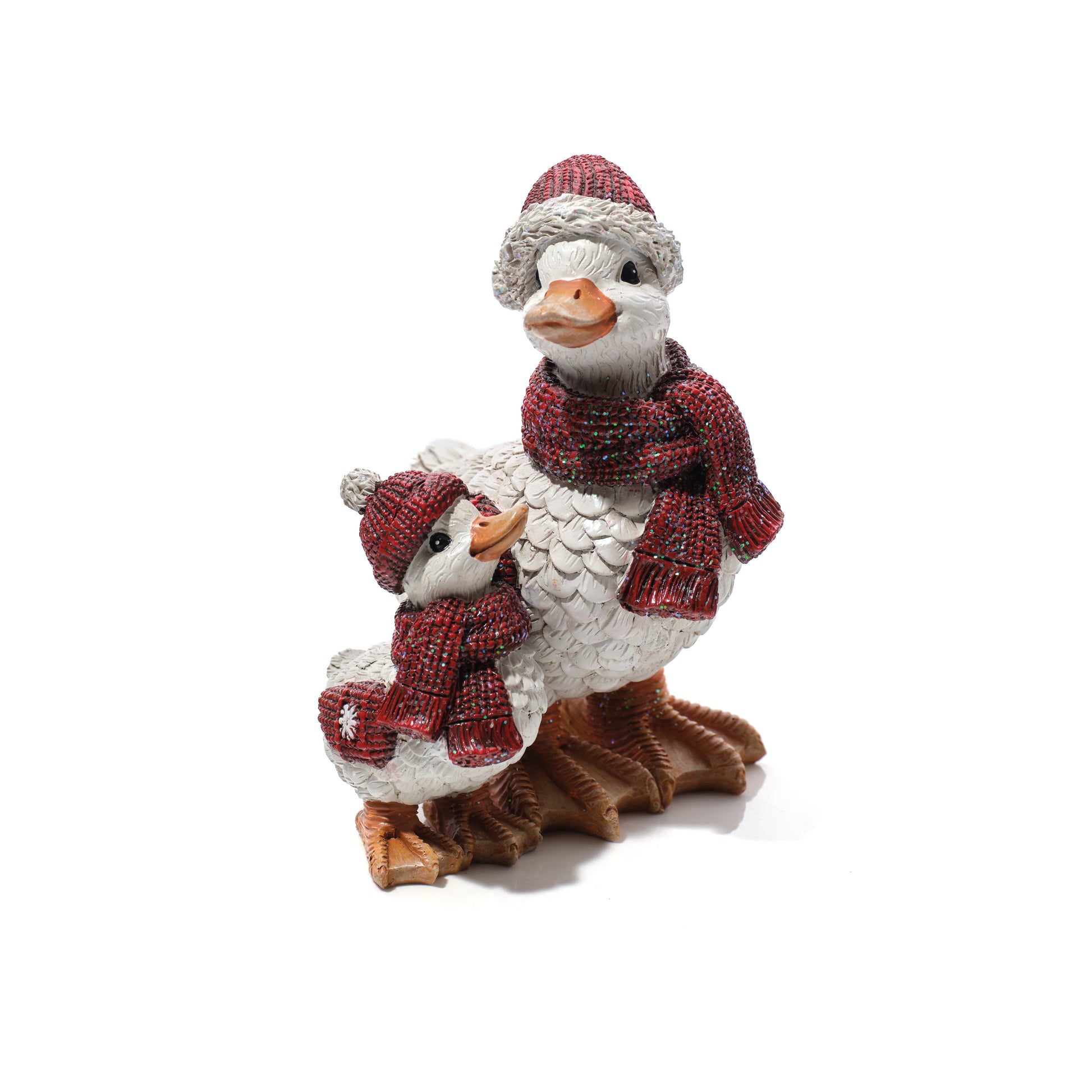A decorative figurine of a mother duck and her chick dressed in matching red knit scarves and hats, standing on a brown base against a plain white background.