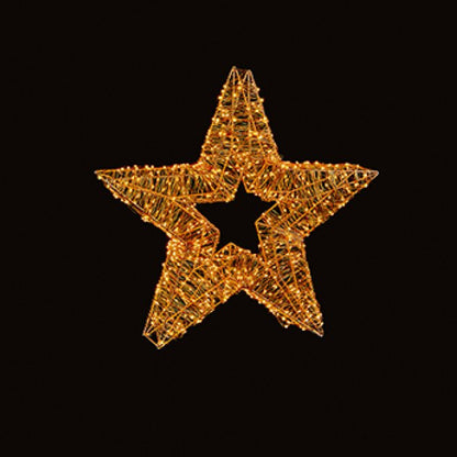 A glowing golden star-shaped decorative light fixture with a starburst center, set against a solid black background.