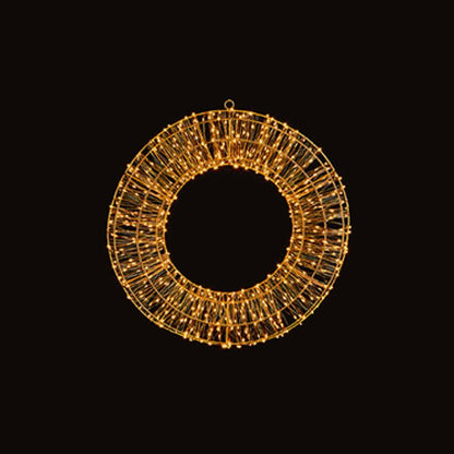 Decorative wreath with gold lights on a black background