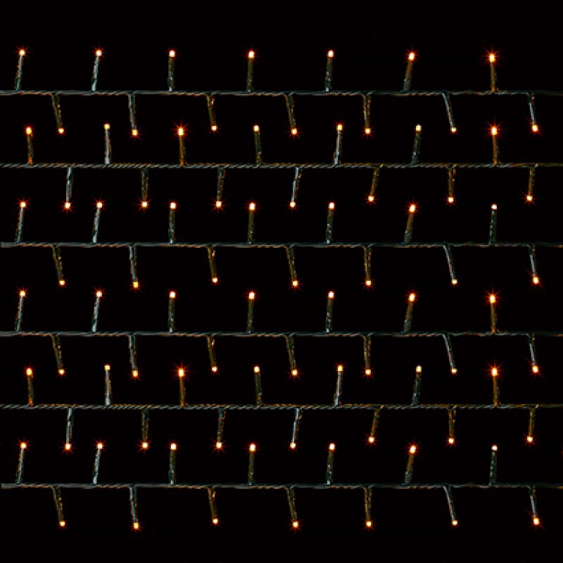 vintage gold string lights in multiple rows of small vertical bulbs on a black background.