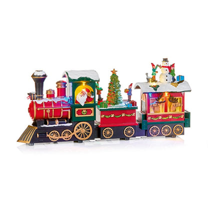 A festive Christmas-themed toy train set featuring a red and green steam locomotive with Santa visible in the cab, a decorated Christmas tree on the middle car, and a snowman figure with gift boxes on the passenger car. The train is shown on a clean white background with a subtle reflection.