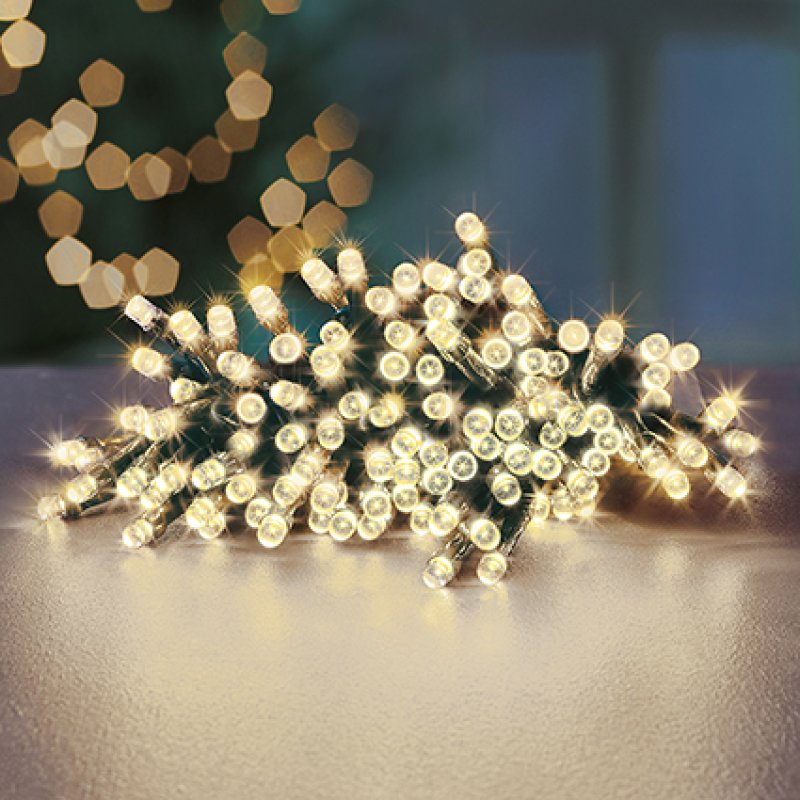 String of lights on a reflective surface with a blurred background