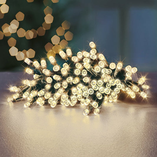 String of lights on a reflective surface with a blurred background