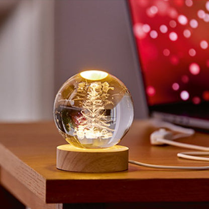 Glass ball light on a wooden base with a blurred background