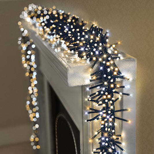 warm white and cool white LED lights draped over a white fireplace mantel.