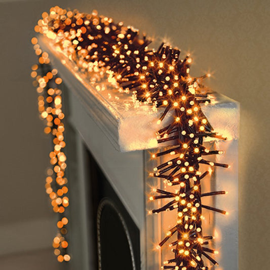 Decorative string lights in vintage gold on a fireplace mantel