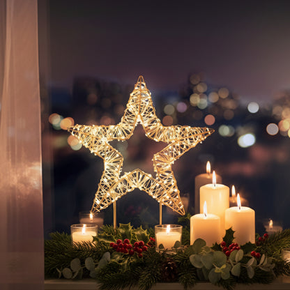 Decorative star light on a stand with a cityscape in the background